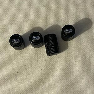 Subaru logo valve Stem caps in black set of 4 NWT